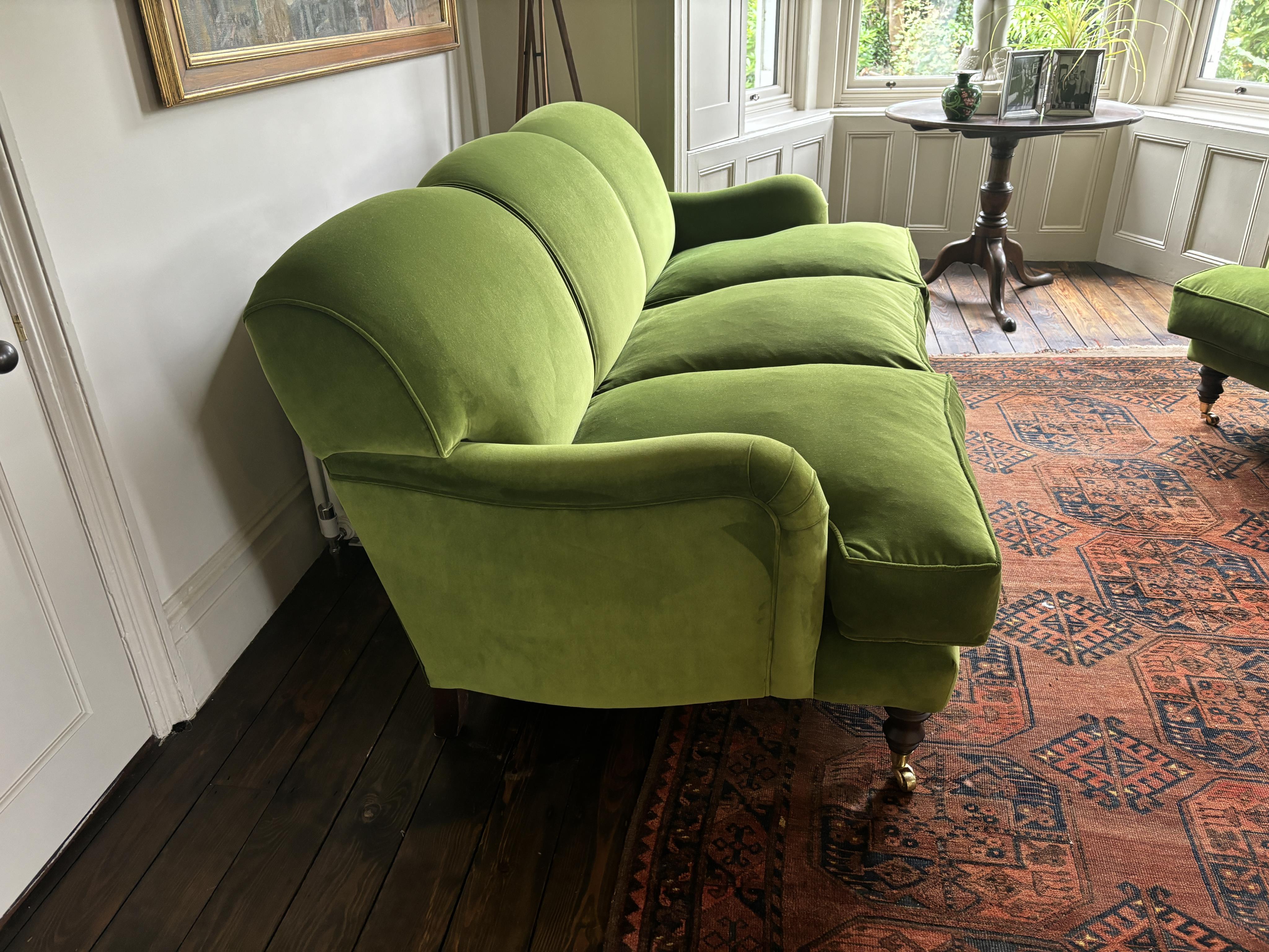 A Sofa Workshop 'Lady May' English roll arm green velvet four seater settee, Howard style sofa, seating generously feather filled, width 200cm, depth 110cm, height 84cm seat height 48cm. Condition - very good